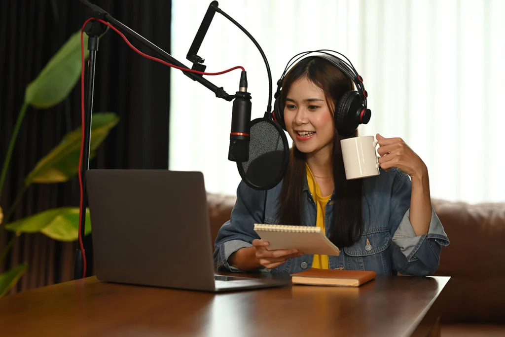woman using condenser microphone